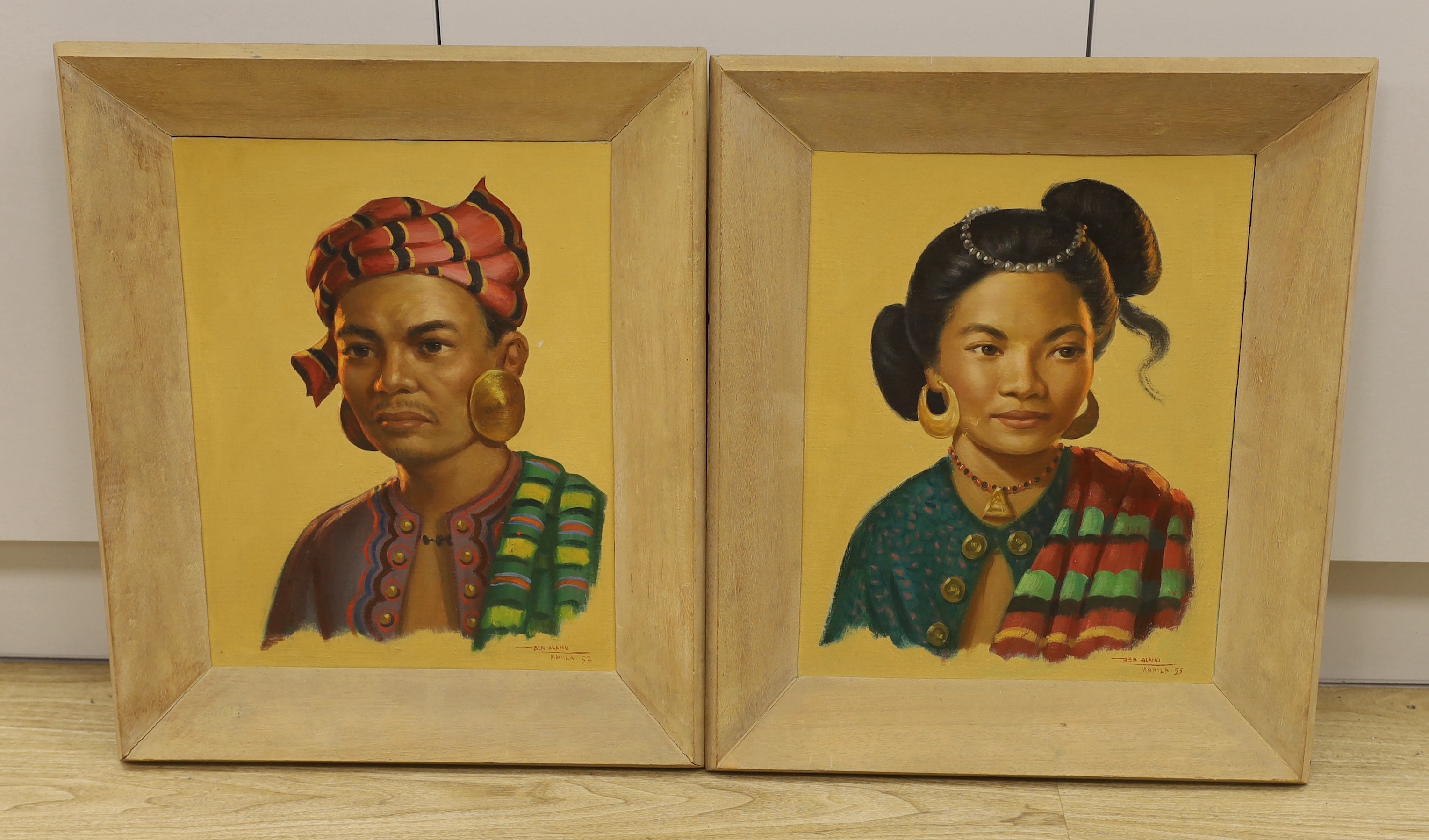 Ben Alano (Philipino 1920 - 1991) pair of oil on boards, Portraits of a lady and gentleman wearing traditional dress, possibly members of the Royal family, signed and inscribed Manila, 44 x 34cm